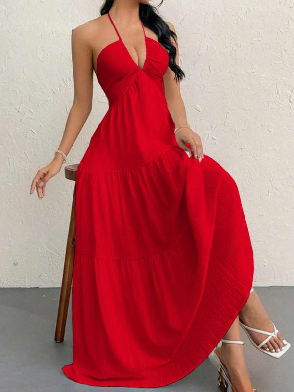 Chic women's long halter maxi dress with a beautiful flowing, tiered silhouette. Ideal for parties.