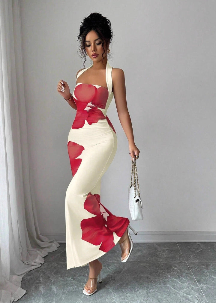 Elegant women's halter maxi dress with bold red floral print, perfect for summer occasions & resort wear.