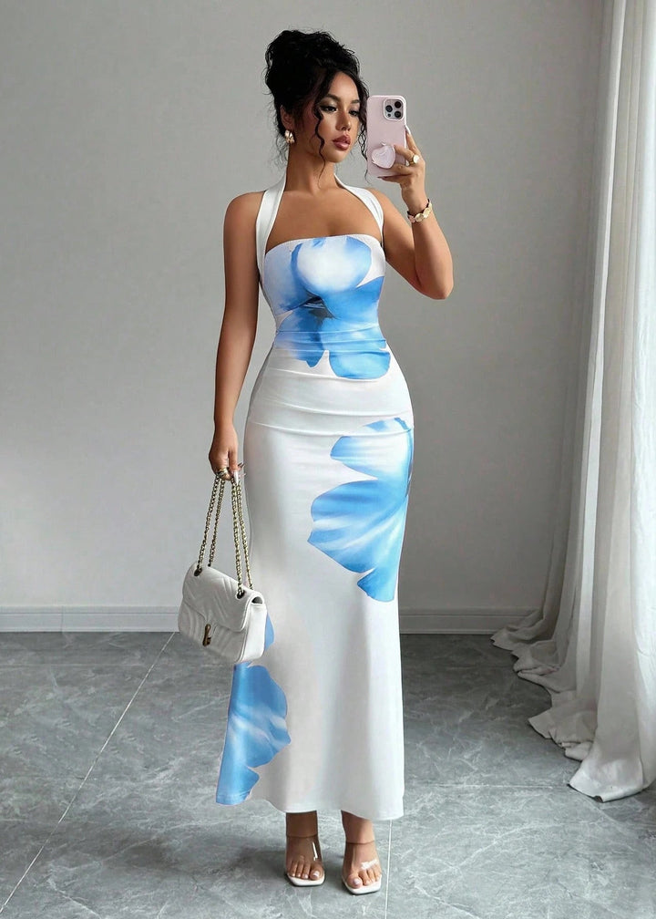 Flowy blue floral print halter maxi dress for women, ideal for parties, formal events & resort fashion.