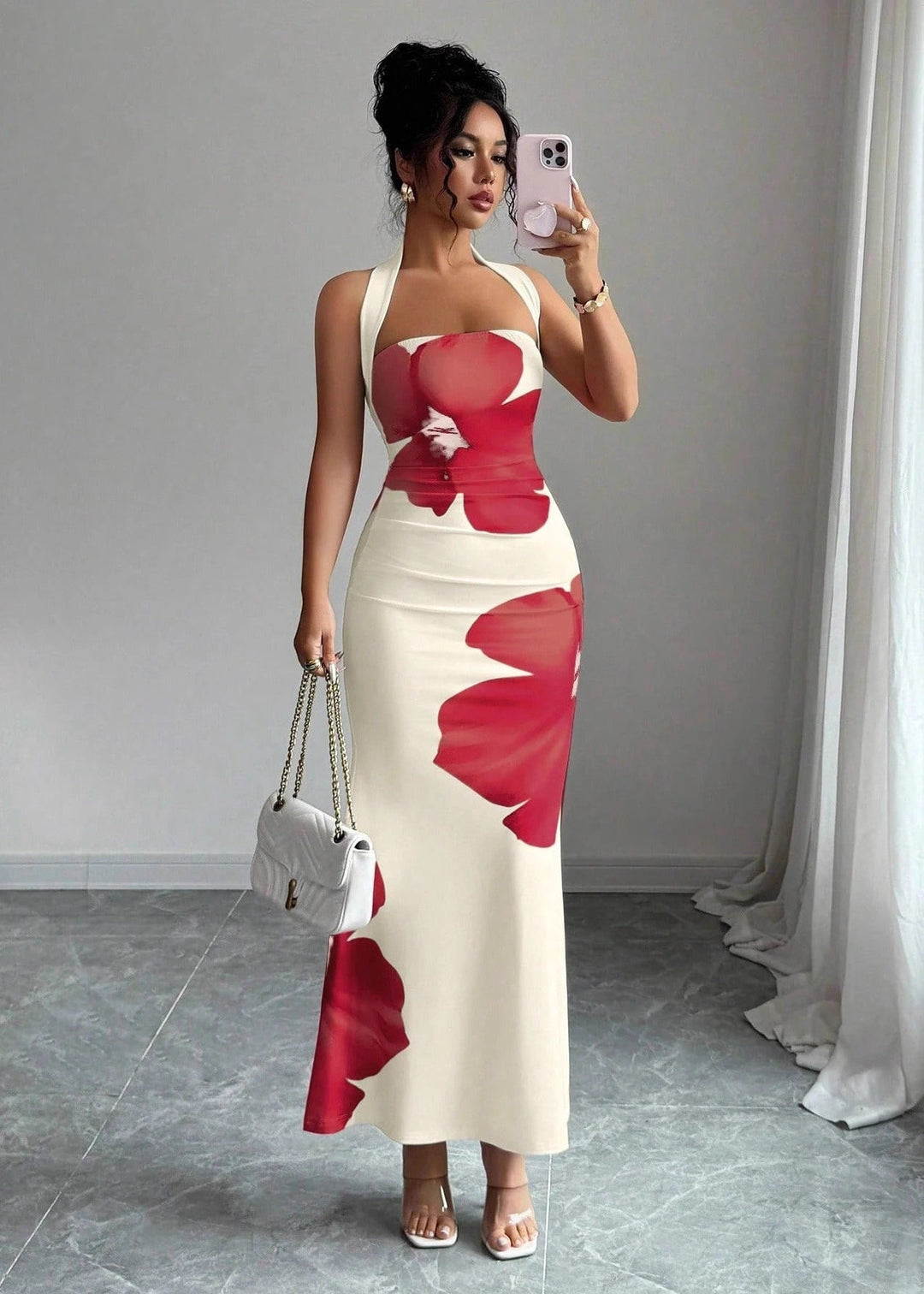 Stylish women's bold floral halter neck maxi dress, a vibrant statement piece for elegant summer wear.