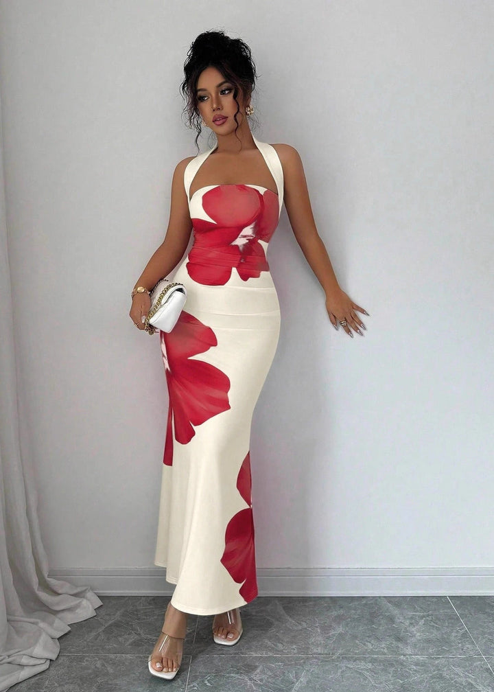 Graceful women's blue floral print maxi dress with halter neckline, suitable for elegant summer parties.