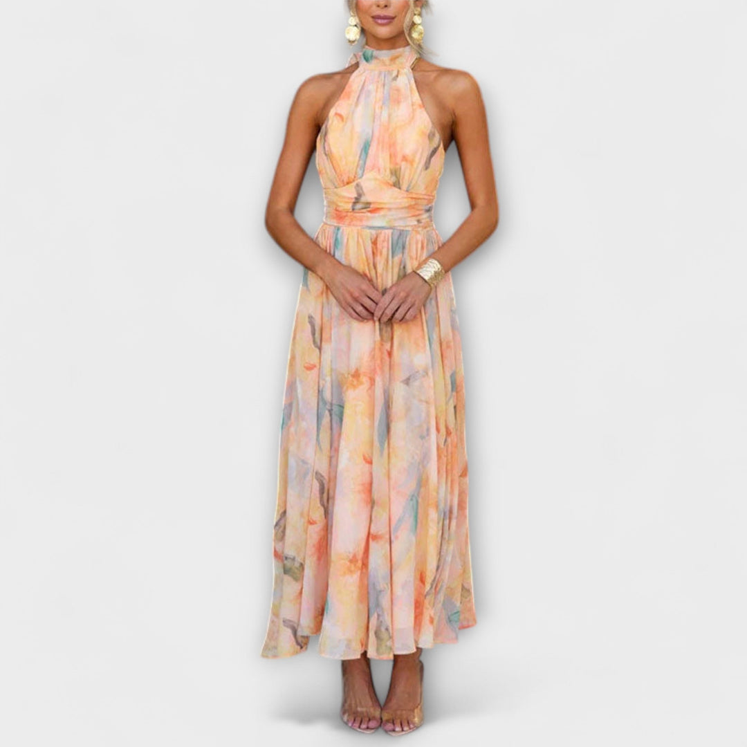 Elegant women's halter maxi dress with vibrant watercolor print, perfect for stylish summer occasions & evening wear.