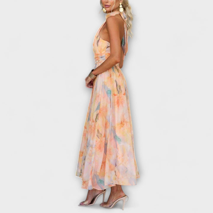 Fashionable women's summer halter maxi dress, elegant and flowy, suitable for various occasions. Watercolor print.