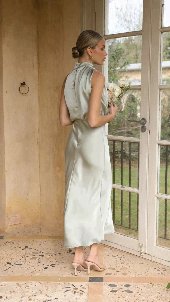 Flattering Halter Midi Dress, an elegant choice for cocktail parties and summer events.