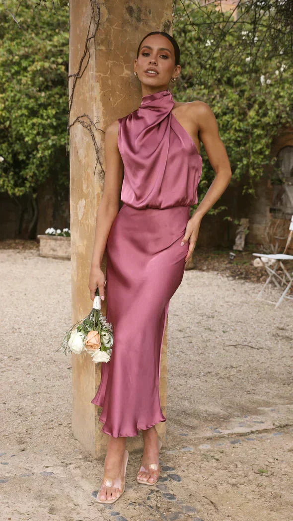 Stylish women's flowing midi dress, a sophisticated halter design for special occasions.