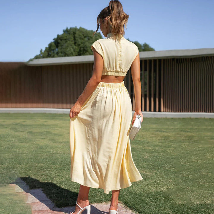Women's casual chic halter midi dress with a contemporary side slit, ideal for warm weather.