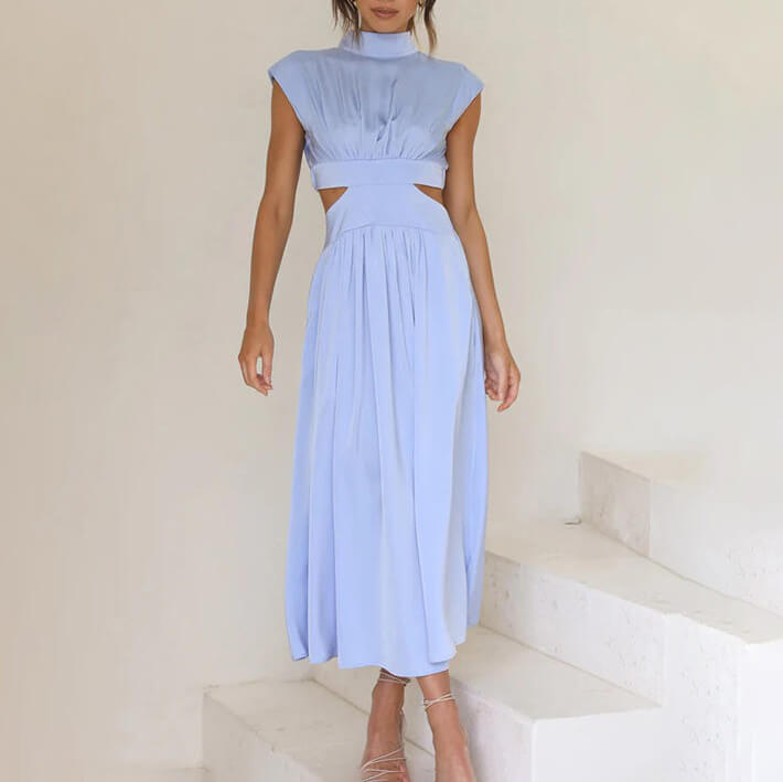 Elegant women's flowy midi dress with a halter neckline and side slit, perfect for evening or day.