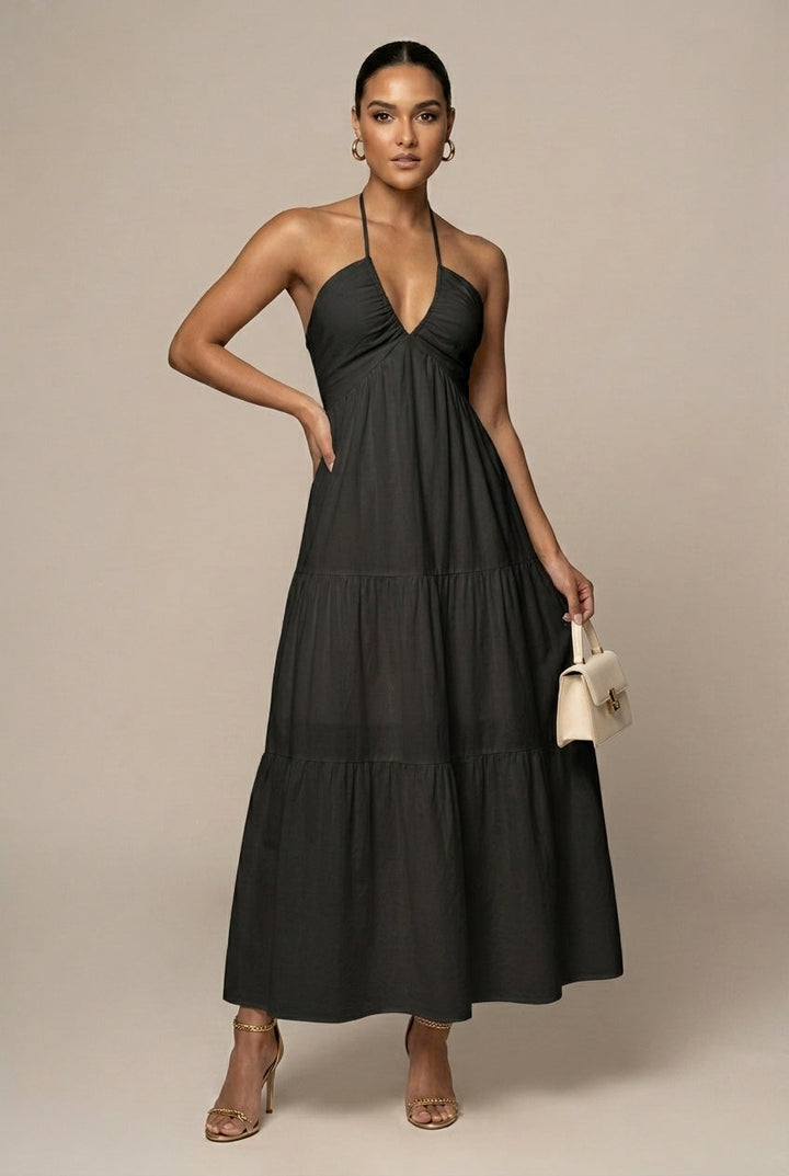 Formal women's halter dress. Elegant tiered ruffle skirt, open back, perfect as a wedding guest or evening dress.