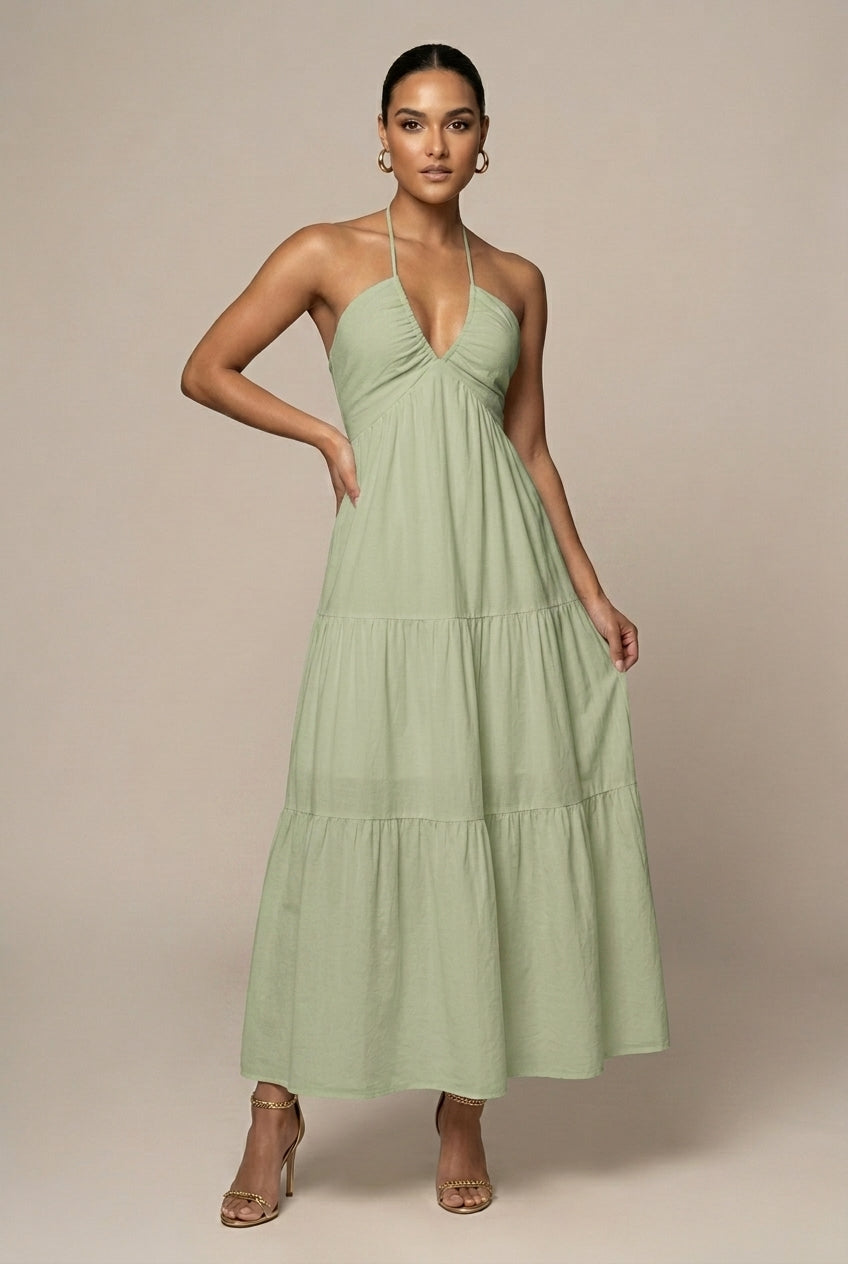Beautiful women's halter neck maxi dress with a dramatic tiered ruffle skirt and alluring open back.