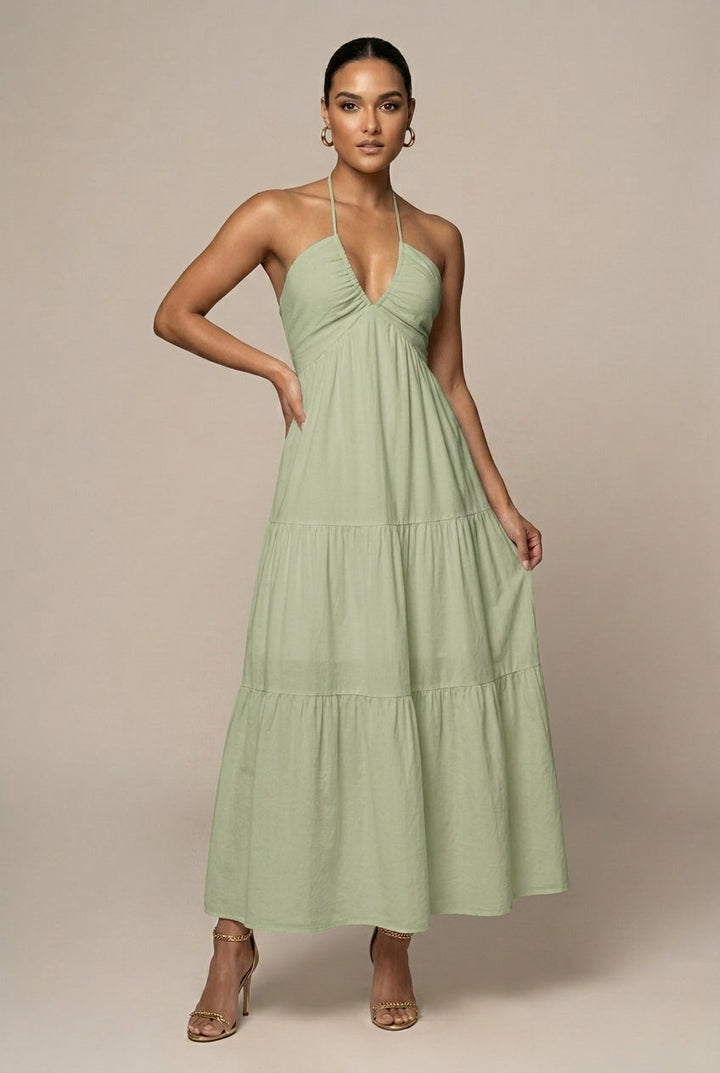 Beautiful women's halter neck maxi dress with a dramatic tiered ruffle skirt and alluring open back.