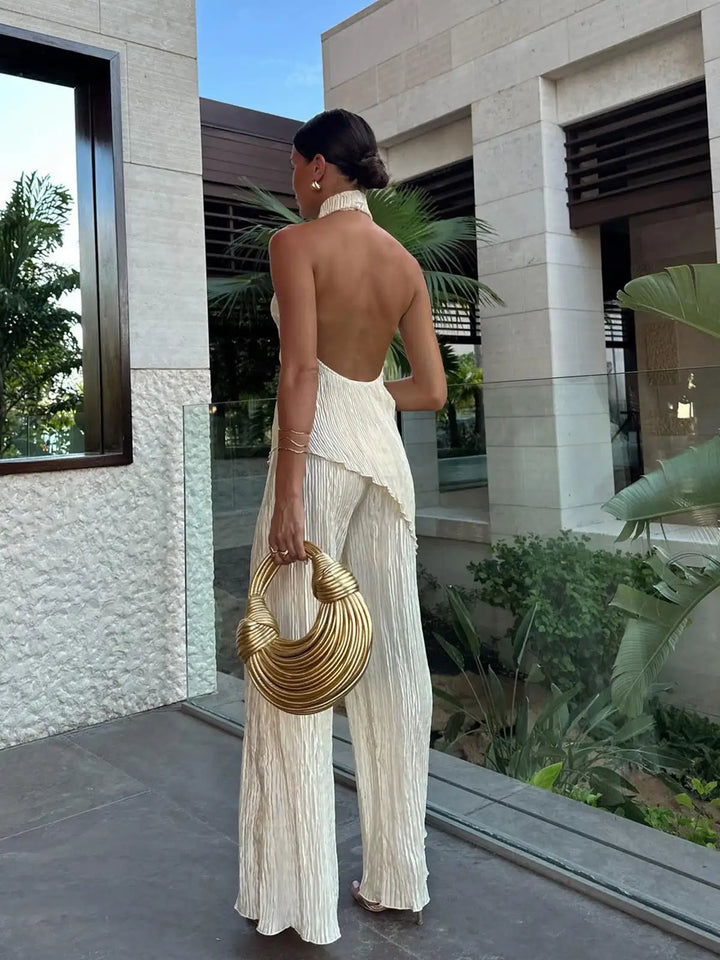 Women's summer fashion two-piece set: pleated halter neck crop top & wide-leg pants for an elegant matching outfit.