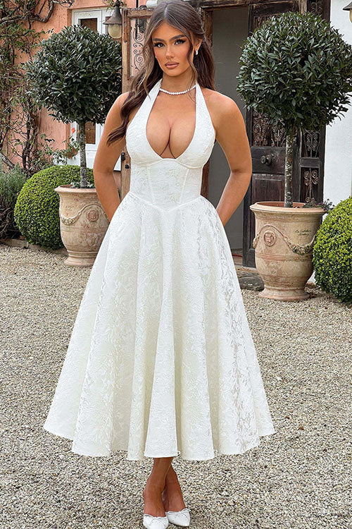 Chic women's long prom dress, elegant halterneck, A-line silhouette.