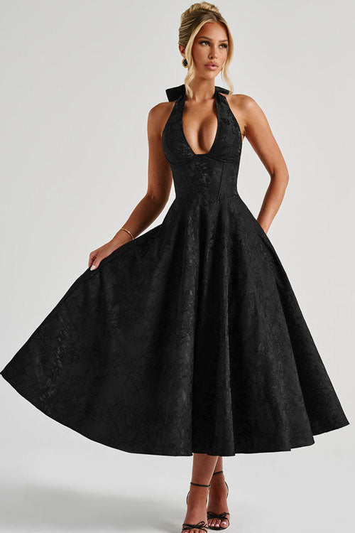 Formal women's evening gown, elegant halterneck style for special events.