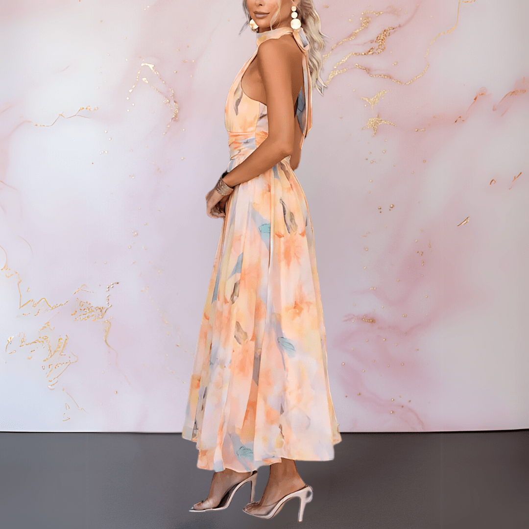 Feminine halterneck watercolour print dress for women. Ideal elegant occasion wear or a stylish summer party dress.