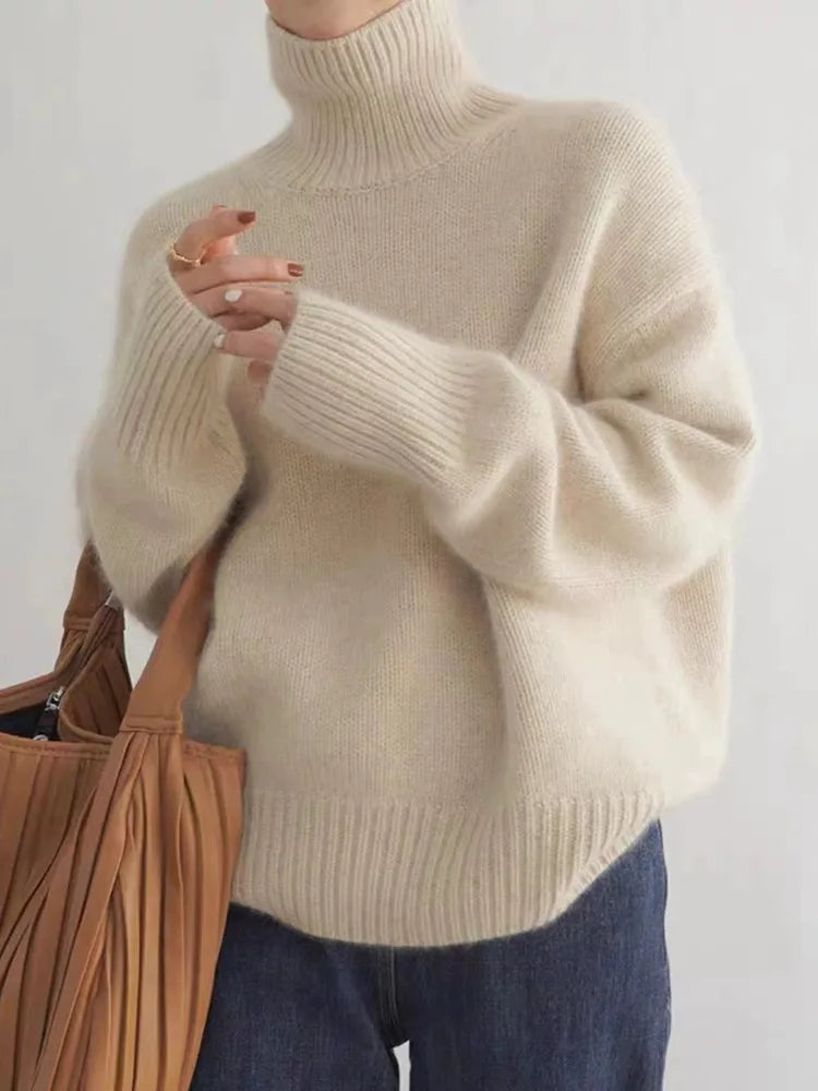Elegant women's high-collar sweater in a cozy knit, perfect for chic fall & winter fashion.