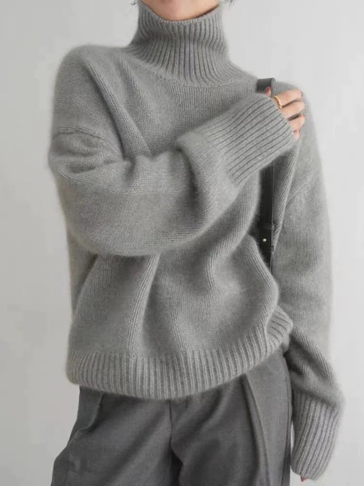 Chic grey women's high-collar sweater, a cozy & comfortable long-sleeve top for winter fashion.