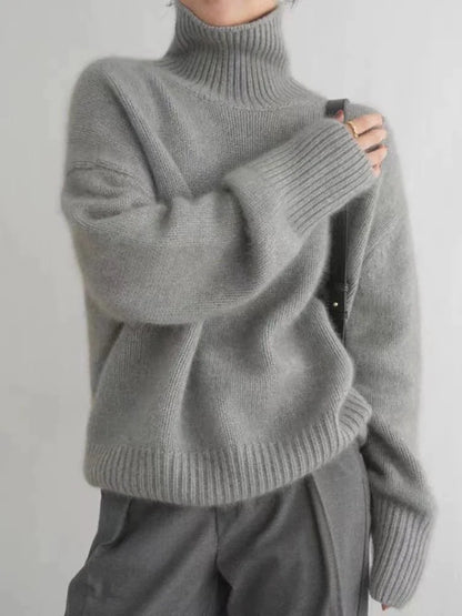 Chic grey women's high-collar sweater, a cozy & comfortable long-sleeve top for winter fashion.
