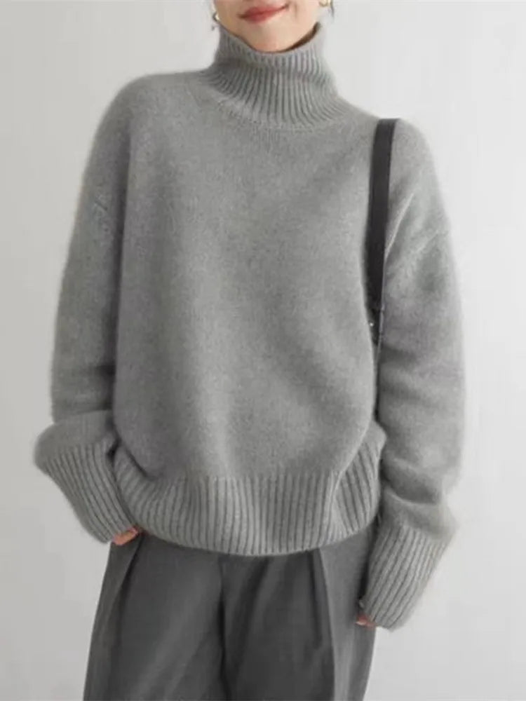 Stylish khaki women's high-collar sweater, an elegant & versatile long-sleeve top for fall and winter.