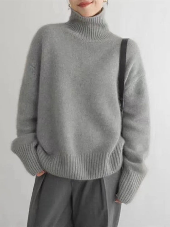 Stylish khaki women's high-collar sweater, an elegant & versatile long-sleeve top for fall and winter.