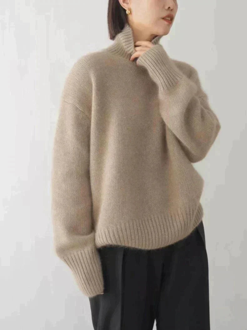 Close-up of a cozy women's high-collar sweater, showcasing the elegant knit and versatile winter fashion.