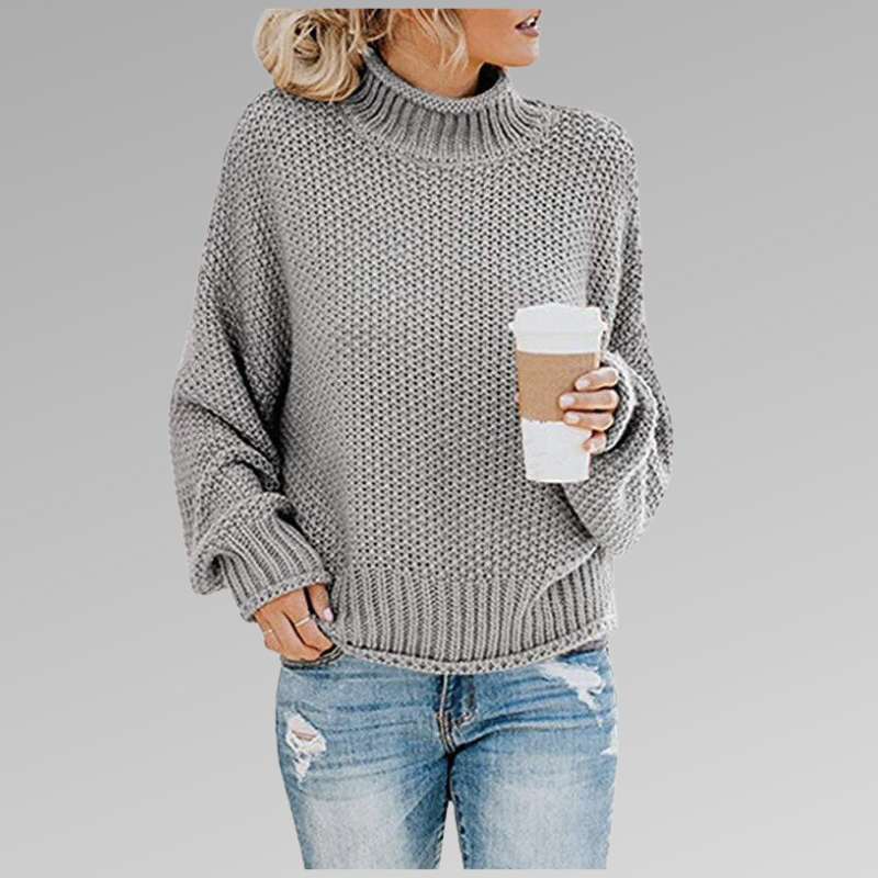 Fashionable women's high-neck sweater with long sleeves, blending chic design & comfort for winter style.