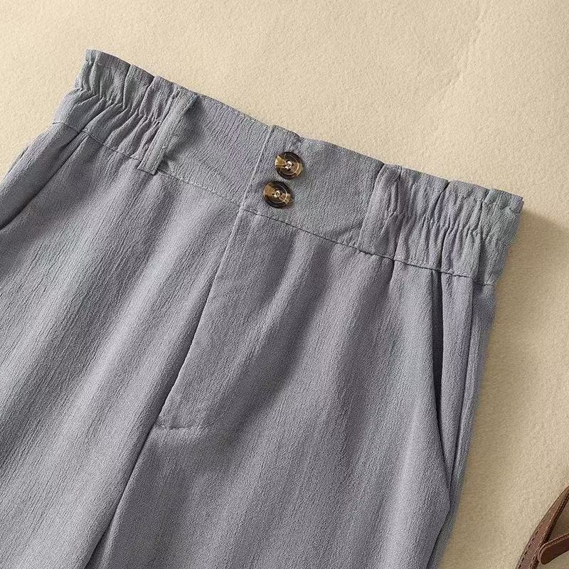 Flowy women's high-waist wide-leg pants for elegant comfort, versatile for summer fashion and relaxed styling.