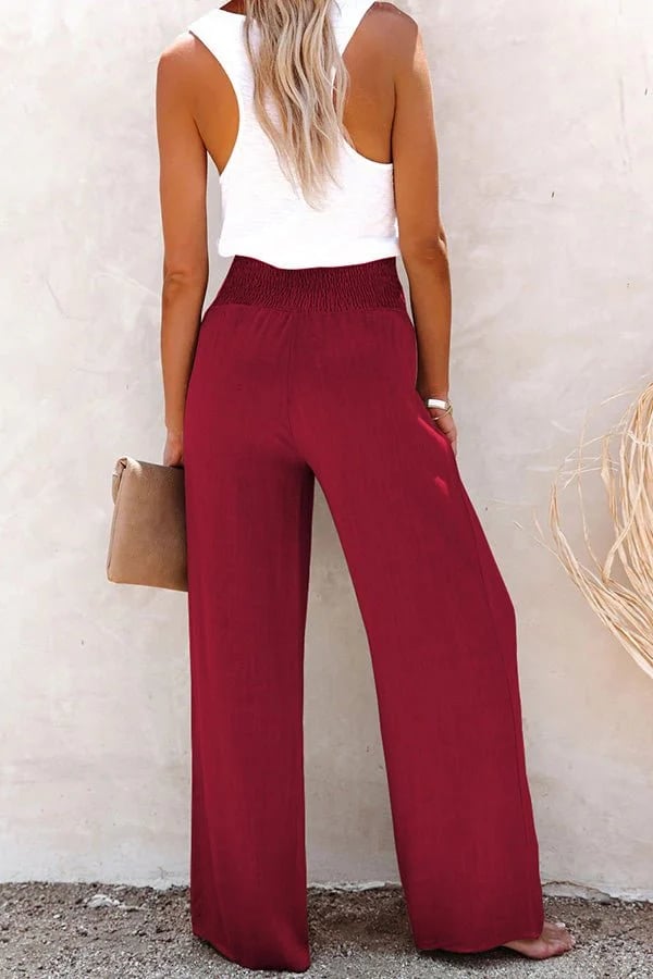 Sophisticated wine red high-waisted tailored trousers, offering women modern comfort and elegant style.