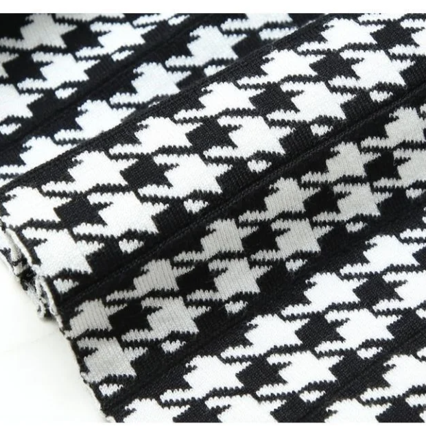 Women's high-waist houndstooth pleated midi A-line skirt. Elegant style, versatile for fall fashion and workwear.