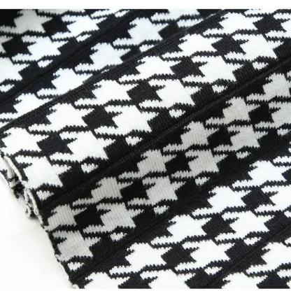 Women's high-waist houndstooth pleated midi A-line skirt. Elegant style, versatile for fall fashion and workwear.