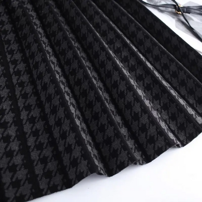 Elegant women's houndstooth pleated midi A-line skirt with a high-waist. Classic print, versatile workwear fashion.