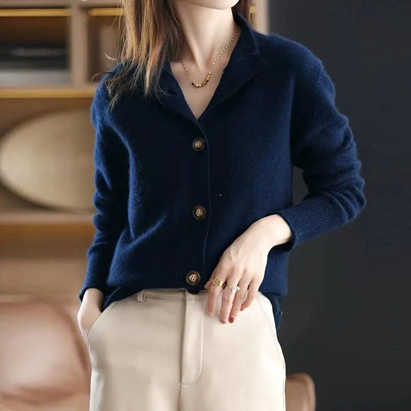 Relaxed fit women's knit cardigan offering winter warmth & fall fashion elegance, an essential layering piece.