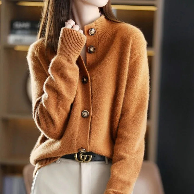 Model in a cozy, relaxed fit women's knit cardigan, showcasing oversized buttons & casual chic style.