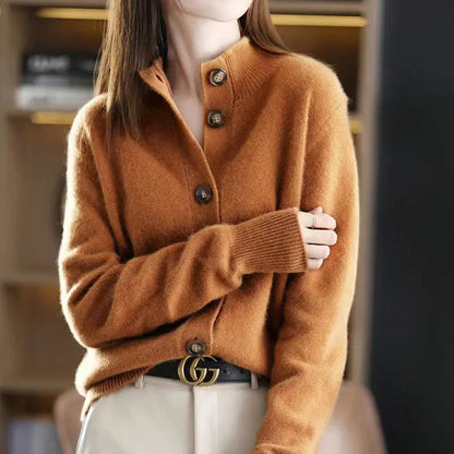 Close-up of elegant women's knit cardigan showing texture, oversized button detail, and quality craftsmanship.