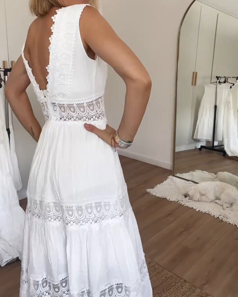 Delicate lace midi dress for women, sleeveless A-line design. Features an elegant V-neck, ideal as a summer day dress.