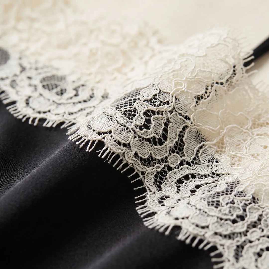Chic women's sleeveless camisole top featuring intricate lace detailing. Soft fabric, perfect for elegant layering.