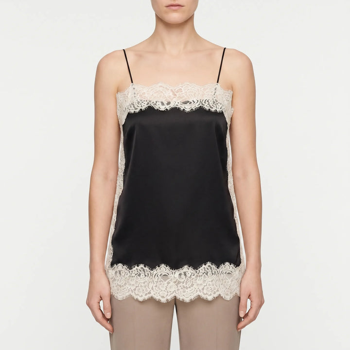 Stylish women's lace camisole top. Elegant, sleeveless, and perfect for versatile fashion and comfortable layering.
