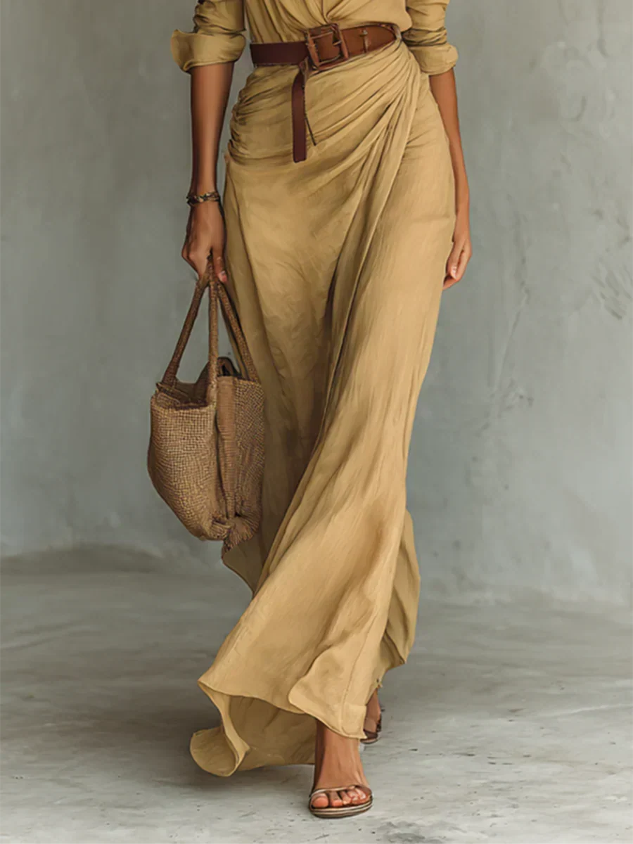 Flowy women's belted maxi dress with lapel collar & long sleeves, ideal for an elegant fall party or event.