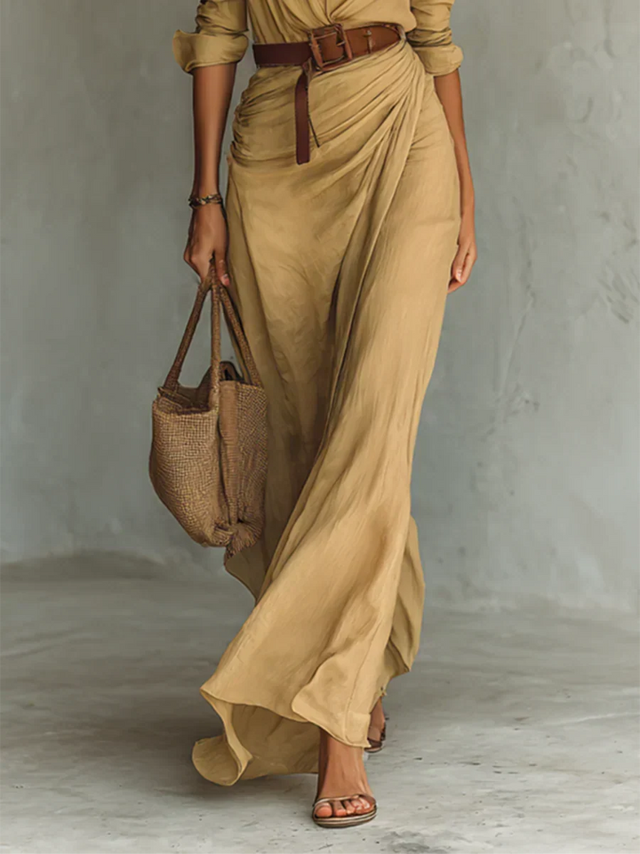 Flowy women's belted maxi dress with lapel collar & long sleeves, ideal for an elegant fall party or event.