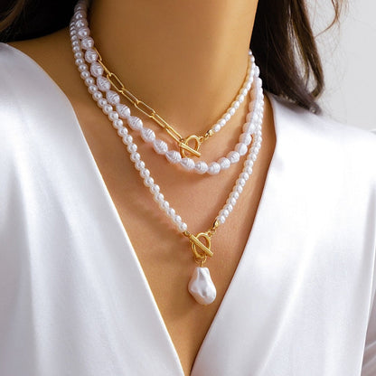 Stylish women's layered pearl & chain statement necklace with toggle clasp, a perfect gift for her.