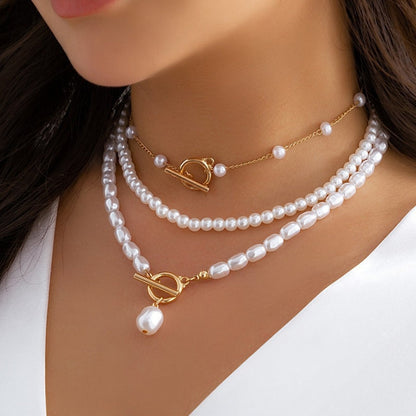 Beautiful layered necklace for women, combining classic pearls & modern gold chains for an elegant look.