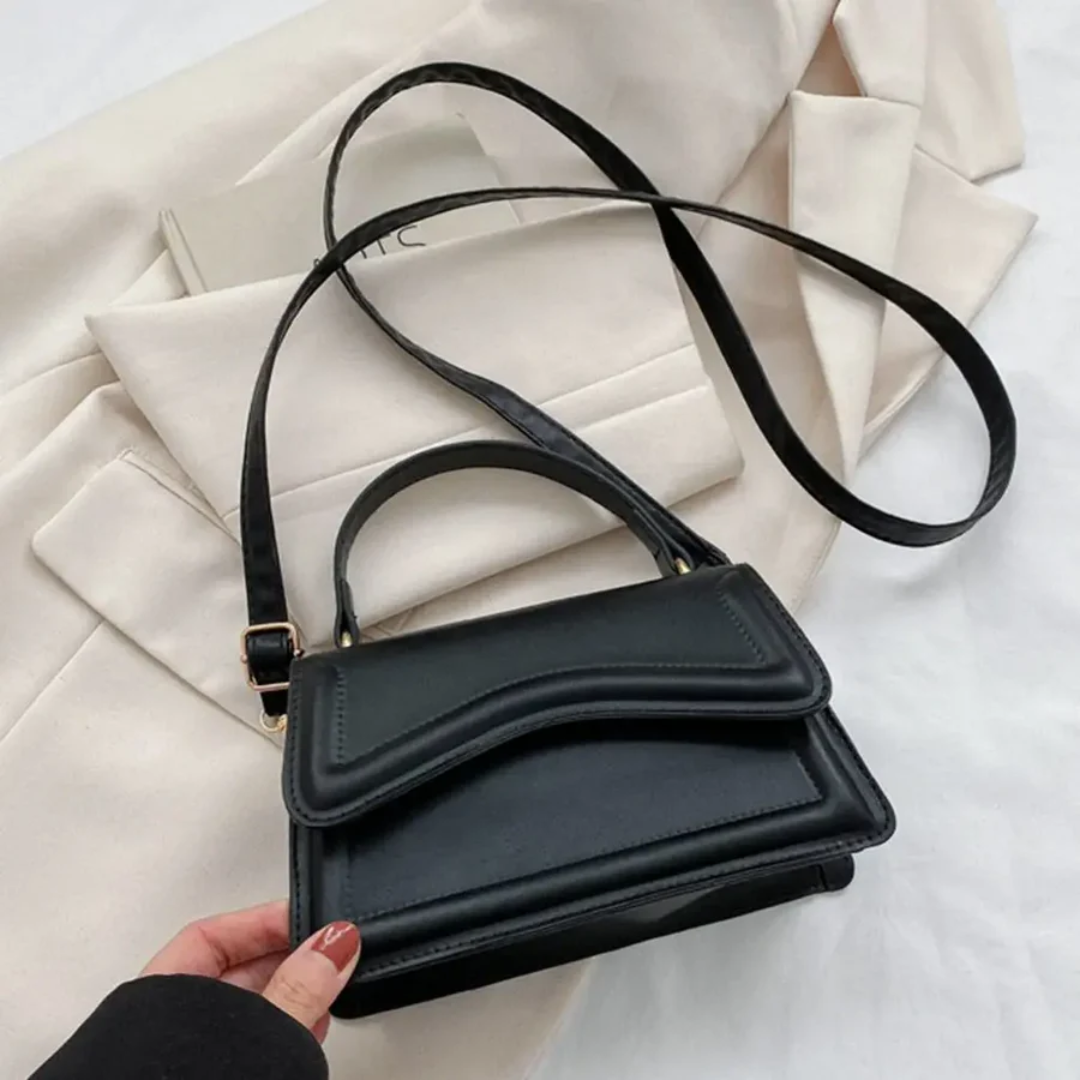 Durable genuine leather shoulder bag for women. Fashionable everyday handbag with multiple organizer compartments.