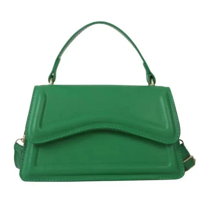 Close-up of elegant women's leather shoulder bag, showcasing luxurious texture and durable craftsmanship.