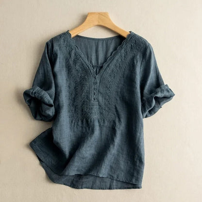 Elegant women's long sleeve blouse with intricate floral embroidery & scalloped details, relaxed fit for chic spring fashion.