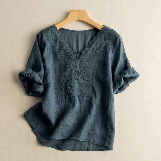 Elegant women's long sleeve blouse with intricate floral embroidery & scalloped details, relaxed fit for chic spring fashion.