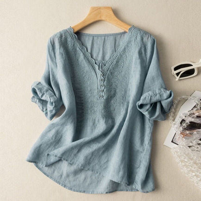 Flowy women's embroidered button-up blouse, relaxed fit, perfect versatile summer top for casual or chic outfits.