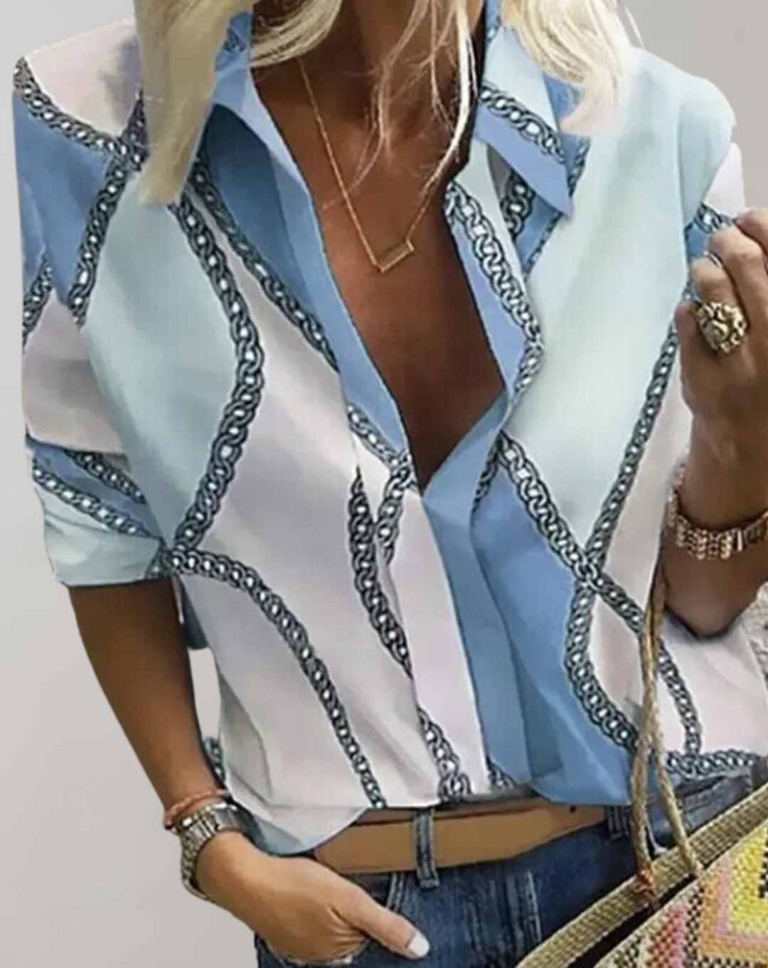 Fashionable women's long sleeve blouse featuring an elegant chain pattern, perfect for a polished office look.
