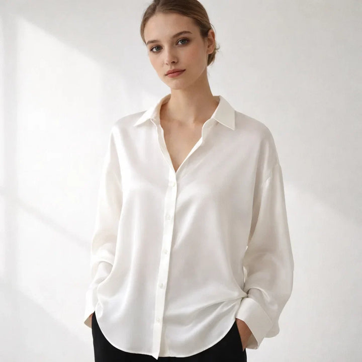 Versatile women's loose-fit blouse with long sleeves, ideal for office and smart casual fashion.