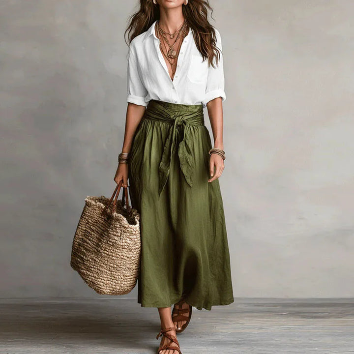 Women's elegant long sleeve skirt suit co-ord set. Chic two-piece outfit with tie-waist skirt, perfect for office & casual fashion.