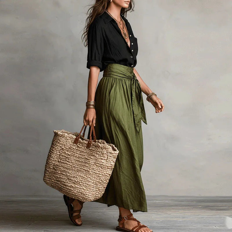 Comfortable women's long sleeve skirt co-ord set. Elegant two-piece outfit with tie-waist skirt, suitable for office or casual style.