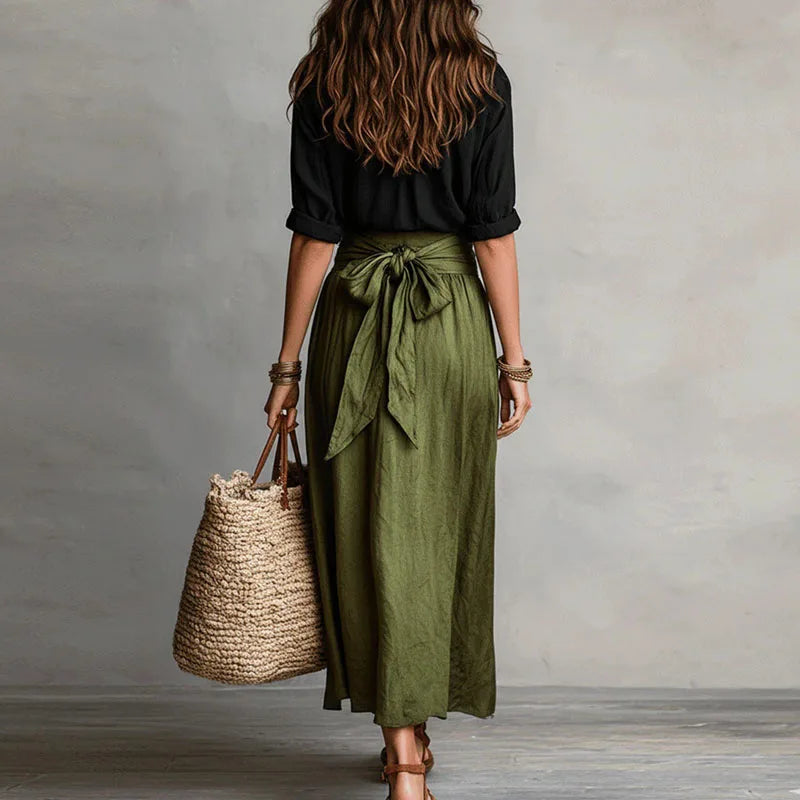 Sophisticated women's long sleeve skirt co-ord. Matching tie-waist two-piece set, versatile for elegant casual or professional attire.